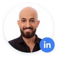 Bald man smiling with LinkedIn icon overlaid on picture.