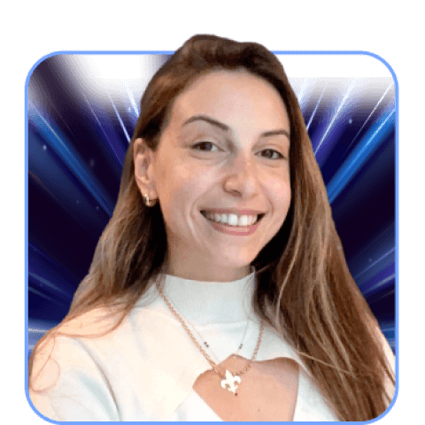 Smiling woman in white top with blue background.