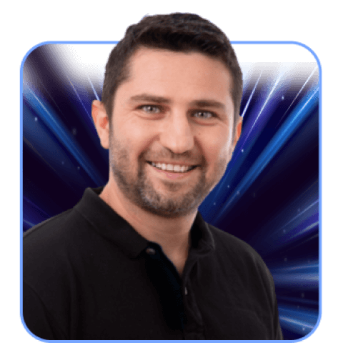 Smiling man with dark background, blue light rays.