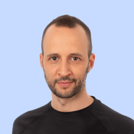 Man with short hair, beard, and black shirt.